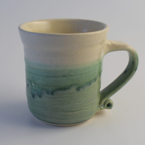 green and white stoneware pottery mug